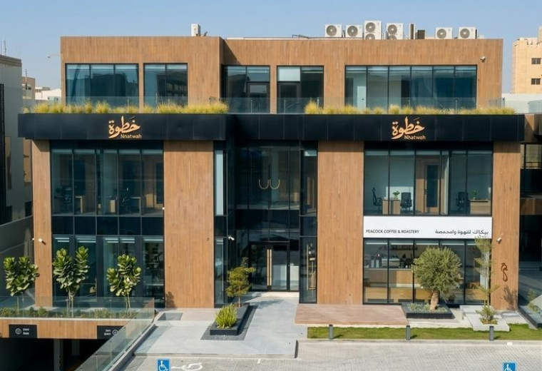 Exterior view of the wood-clad and glass facade building at King Abdul Aziz Branch Road,Al Yasmin District.