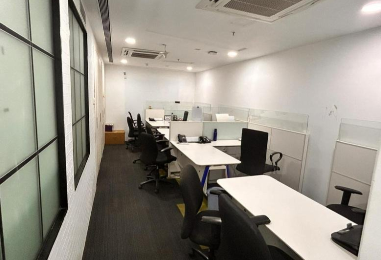 Office building exterior with glass facade at Lotus Corporate Park.