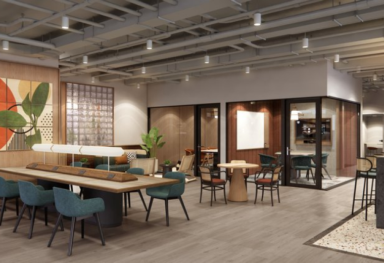 Spacious coworking lounge at No. 1 and 3 Jalan P. Ramlee featuring long wooden tables and blue chairs.