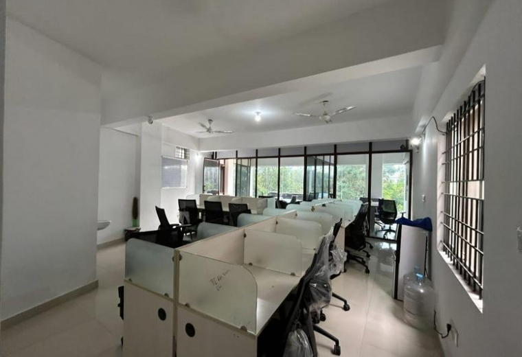 Office space at #1, 3rd Floor, 24th Main, Opp. Government School, Agara Village, HSR Layout with white desks and black chairs.