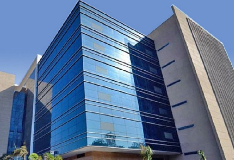 Exterior facade of the blue glass and stone Redbrick Offices, Kalpataru, Wagle Estate.