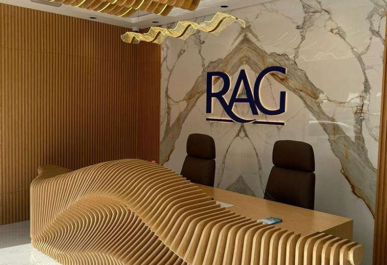 The stylish reception at Sheikh Zayed Road, Business Bay Metro station with a wave-pattern desk.
