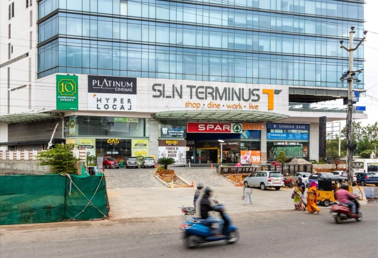 Sleek glass entrance and reception area at SLN Terminus.