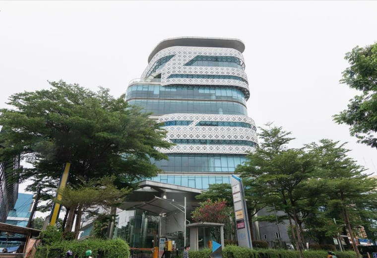 Exterior view of the contemporary tiered facade of The Vida building.
