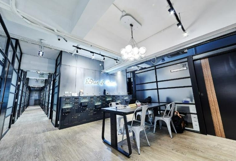 Spacious reception area with modern lighting and a large desk at Block B, Seaview Estate.