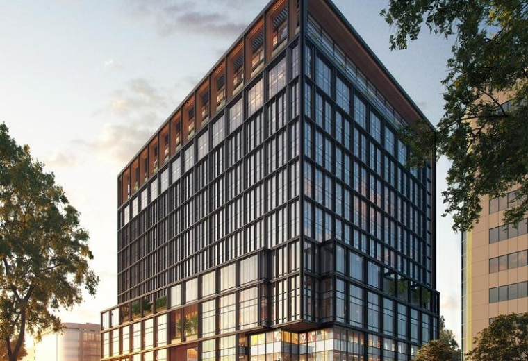 Exterior view of the modern glass and steel One Fukuoka Bldg. facade under a blue sky.