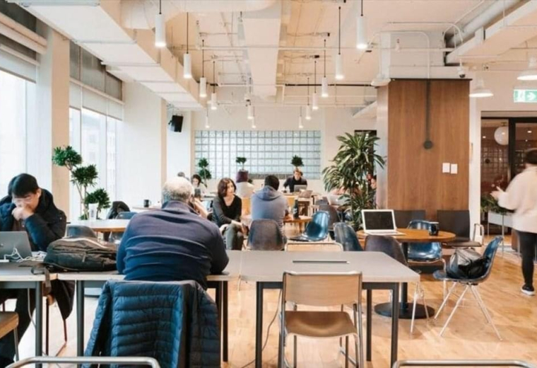 Spacious communal lounge at Seomyeon, 155-1 Bujeon-dong, Busanjin-gu with long tables and warm lighting.