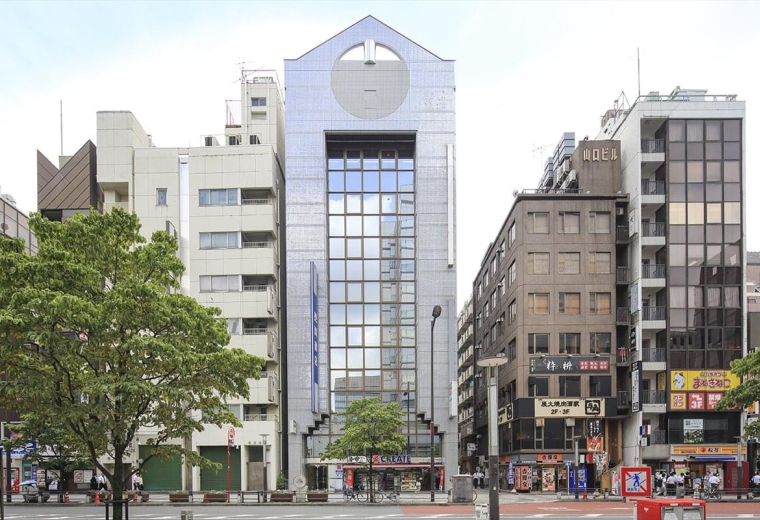 Street-level view of the office building facade showing the ground floor entrance.