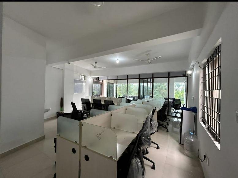 Office space at #1, 3rd Floor, 24th Main, Opp. Government School, Agara Village, HSR Layout with white desks and black chairs.