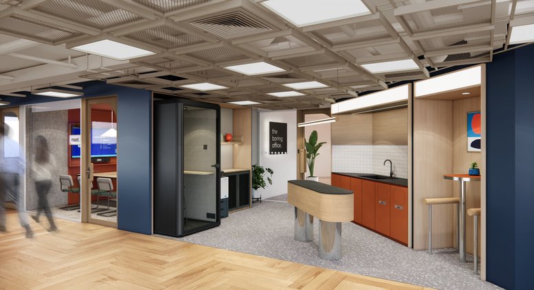 Communal breakout area with a modern kitchen island, wood-look flooring, and a creative coffered ceiling.