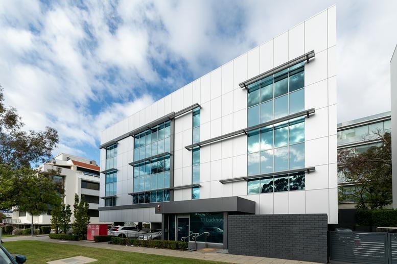 Exterior view of the modern white office building at 11 Lucknow Place.