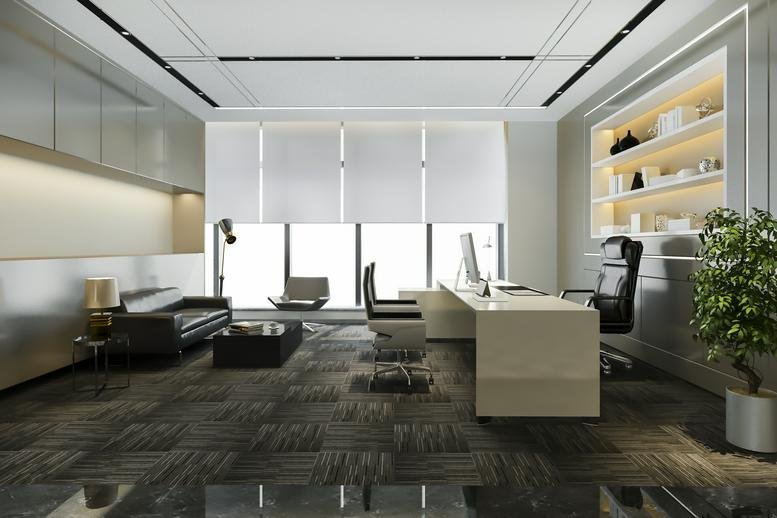 Executive private office at 135/1, Doctor Rajkumar Road, 2nd stage, featuring a modern desk and leather lounge seating.