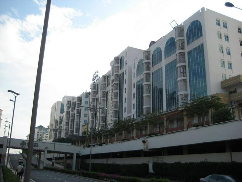 Exterior view of the white facade and arched windows at Kelana Centre Point.