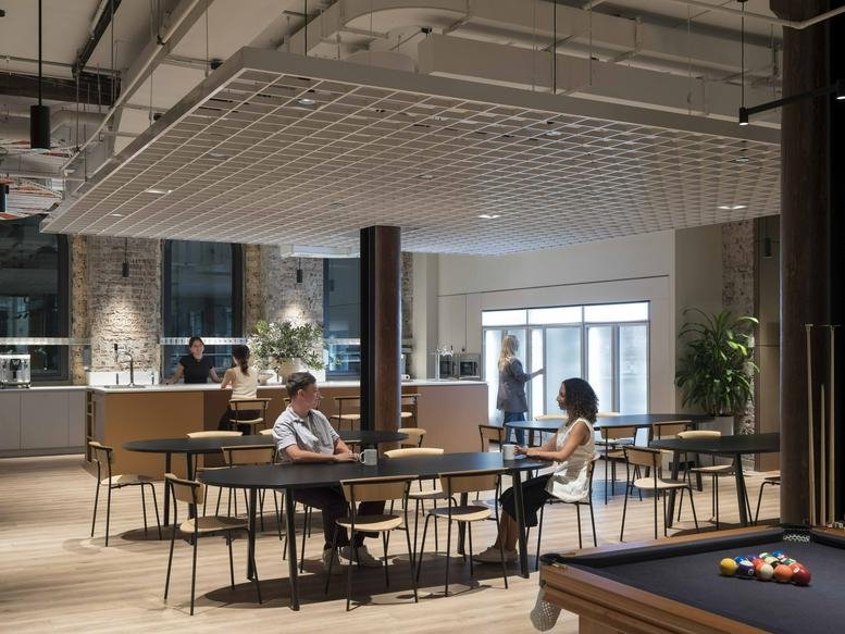 Large communal breakout area with a pool table and café seating at 32 York Street.