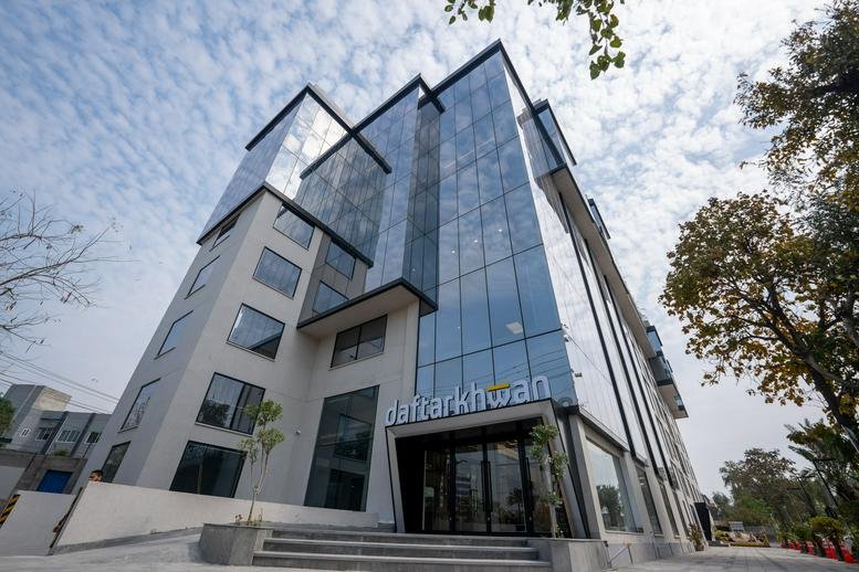Exterior view of the modern glass-facade building at 34-S Main Boulevard, Block K, Gulberg.