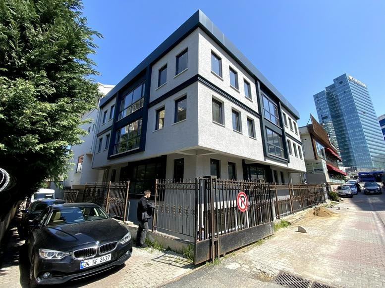 Exterior view of the modern light-grey office building at 4, Umman Sokak, İNKILAP Mah.