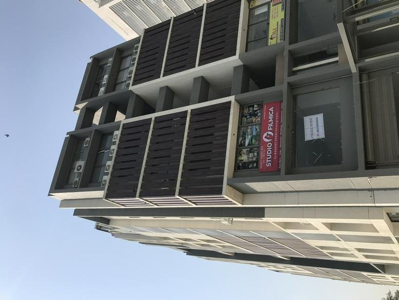 Exterior view of the modern multi-story commercial building facade at 501, Skywalk The Element.