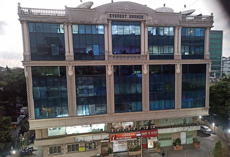 Exterior view of the glass-facade Everest Grand building in Mumbai.