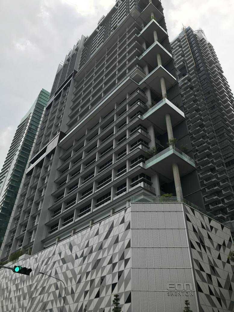 Exterior view of the modern high-rise skyscraper facade at Eon Shenton.