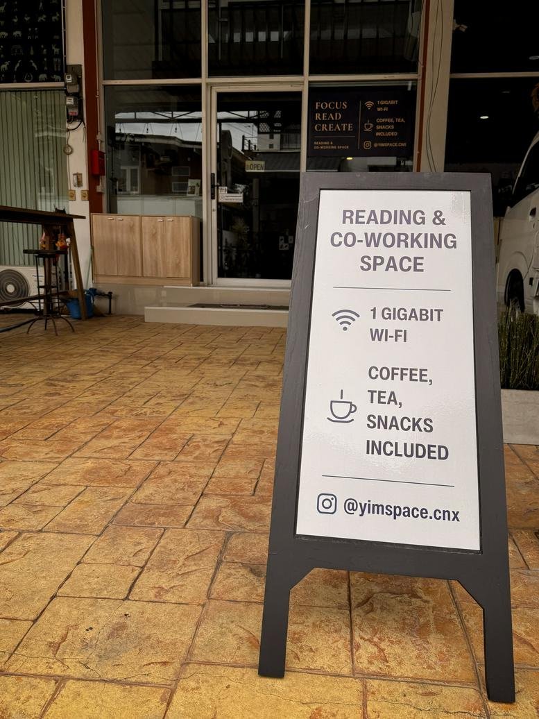 Exterior entrance at 7/3 Siri Mangkalajarn Road Lane 7 with a co-working space sign.