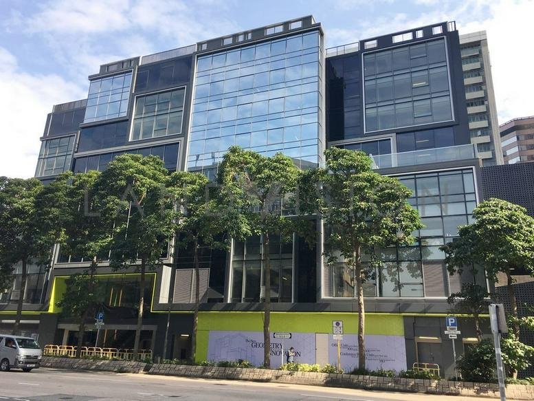 Exterior view of the modern glass-facade building at 8 Wang Kwong Road.
