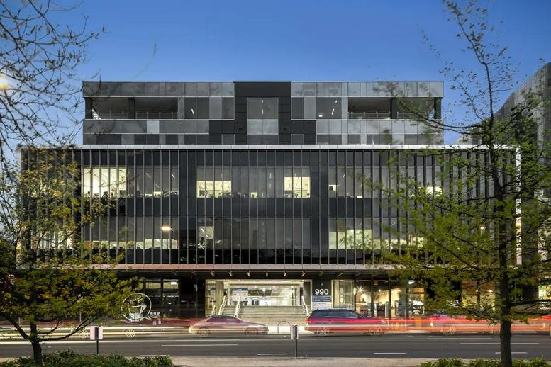 Modern exterior view of the multi-story commercial building at 990 Whitehorse Road, Level 2.