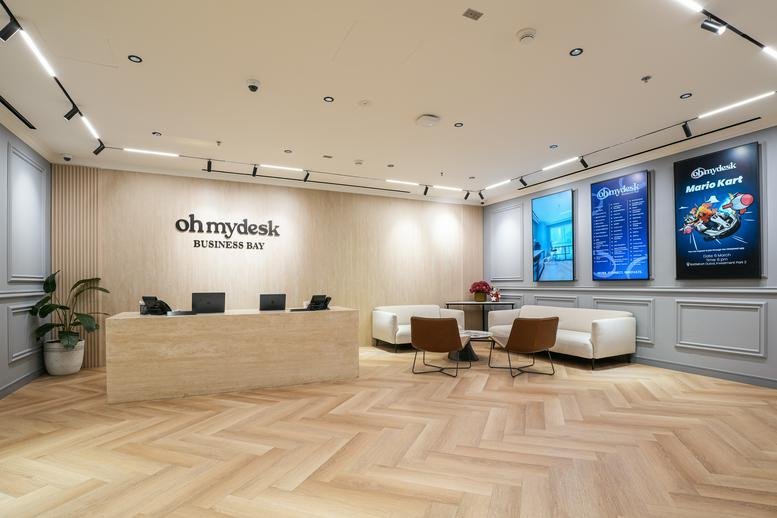 Spacious reception lobby of Baysquare Building 12 P Floor with stylish furniture and digital displays.