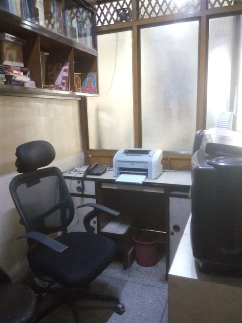 Private office at 2 Dutta Sarani, Dalhousie, Kolkata featuring a workstation with a printer and ergonomic chair.