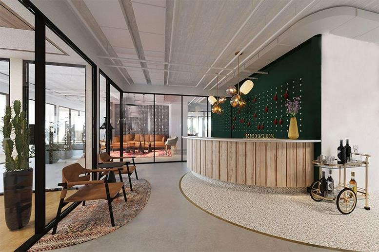 Reception area at 46 Derech Menachem Begin with a curved wooden desk and dark green feature wall.