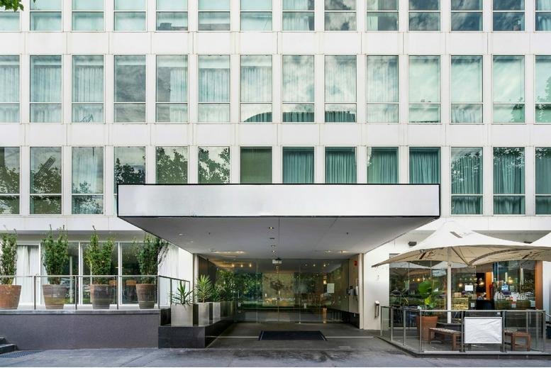 Exterior view of the entrance and modern facade at 604 St. Kilda Road, Melbourne, Victoria.