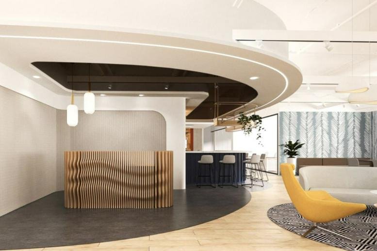 Modern reception area with a curved wood-slat desk at 79 Anson Road, Singapore.