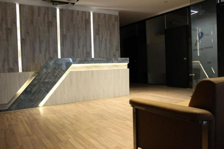 Sleek reception area at B-38, Old DLF, Stand Alone Building, Gurugram with a minimalist front desk and wood paneling.