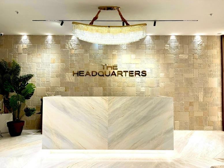 Marble reception desk with a backlit sign at Capital Pk Rd, Ayyappa Society.