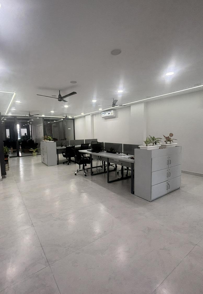 Spacious open-plan workspace at Emaar Central Plaza with multiple desk banks and bright LED lighting.