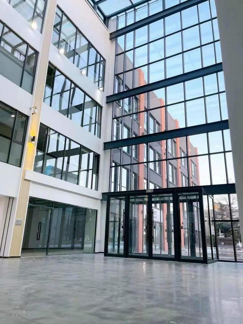 Interior view with glass walls and a spacious lobby.