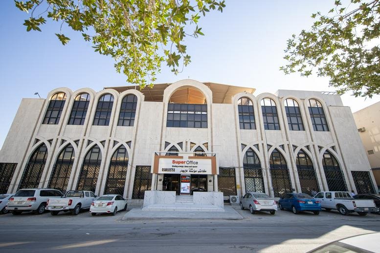 Grand stone facade and entrance of Ibn Kathir Street, Building No. 44, King Abdul Aziz.