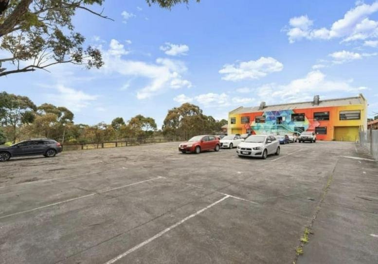 Exterior view of the colorful mural-covered building at Factory 2 / 10-12 Moreland Road.