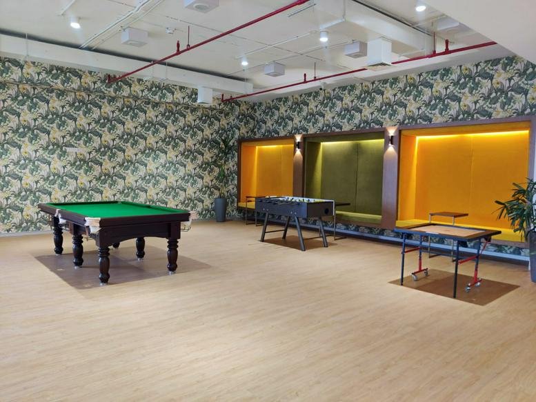 Spacious game room at 3rd Floor, Landmark Cyber Park, Gurugram with a pool table and patterned wallpaper.