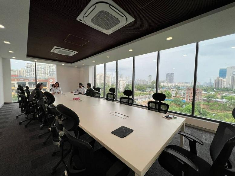 Bright, high-floor boardroom at 3rd Floor, Landmark Cyber Park, Gurugram with panoramic city views.