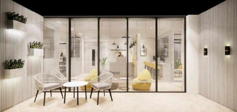 Brightly lit reception area at Plot No. D-C2, Lal Kothi Scheme with modern glass partitions.