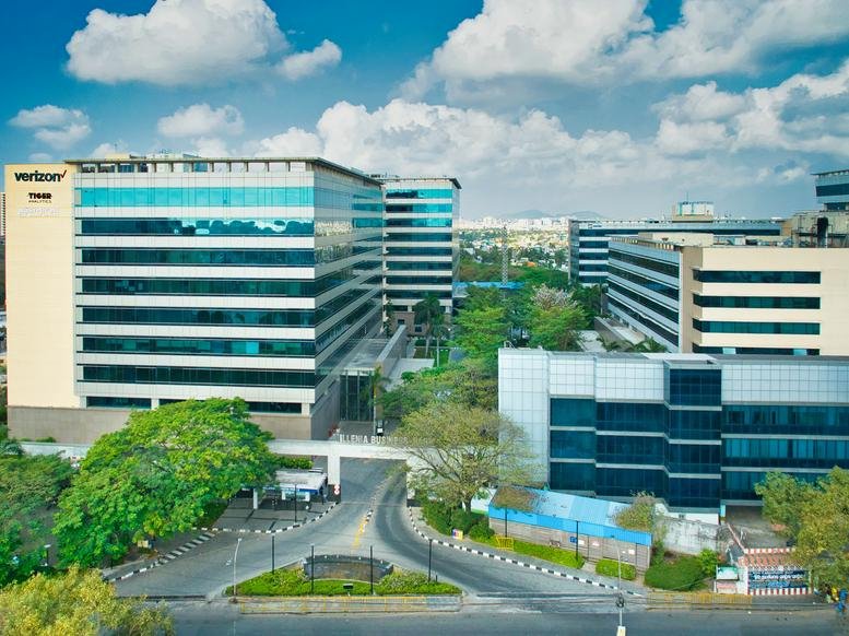 Exterior view of the modern glass-facade RMZ Millennia Business Park II.