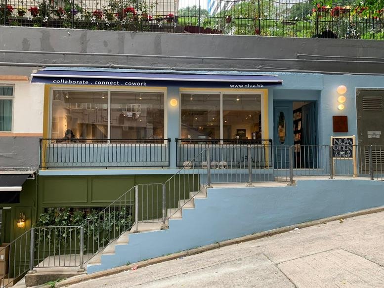Exterior view of the blue-painted shopfront at 1 Electric Street, Wanchai, Hong Kong.