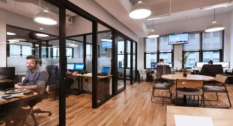 Spacious open-plan common area at 101 Chao Yang Bei Lu with wood floors and glass partitions.