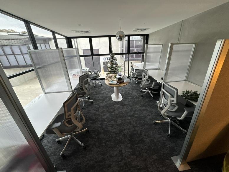 Spacious open-plan office at 25 Val Reid Crescent, Hume Industrial Estate, Canberra with modern desks and partitions.