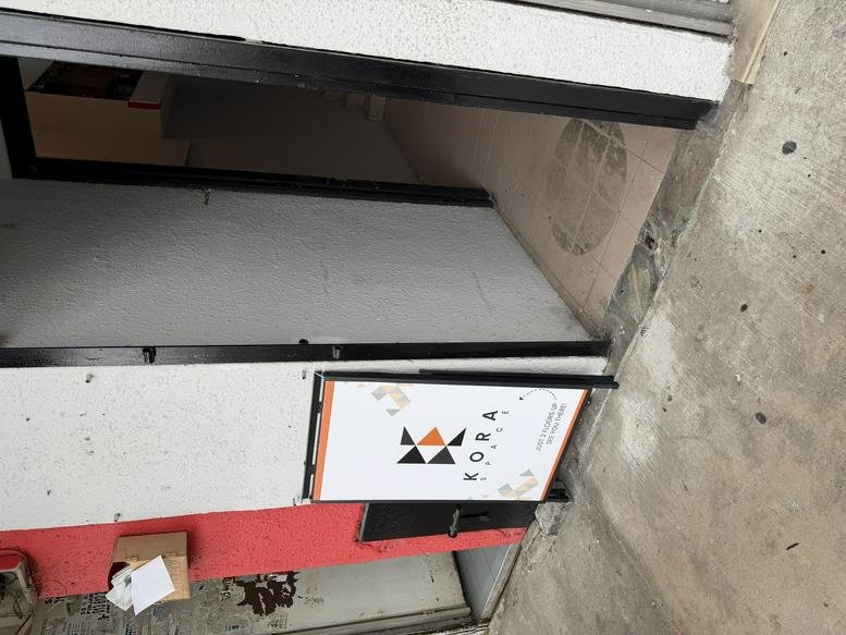 Entrance signage for Kora Space at 90A Jalan SS21/35, featuring a branded logo on a door.