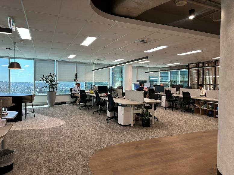 Spacious open-plan workspace at Level 20, 99 Walker Street, North Sydney with city views and natural light.