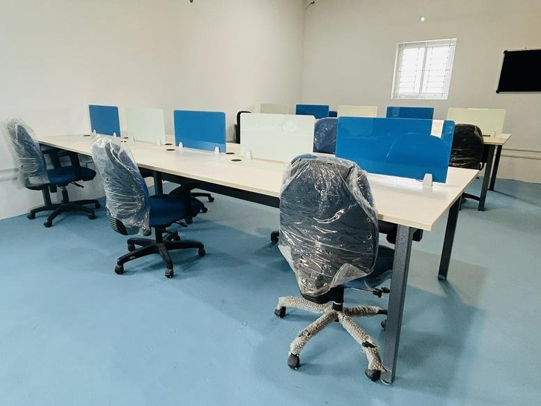 Wide-angle view of an open-plan office space at Mettupalayam Road, Pogalur, Coimbatore, India.