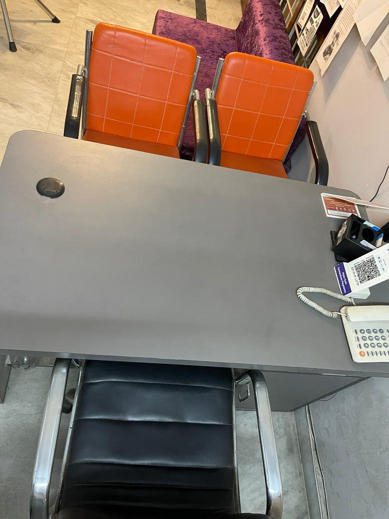 Reception area at SCF 30F, Bhai Randhir Singh Nagar with orange and purple seating.