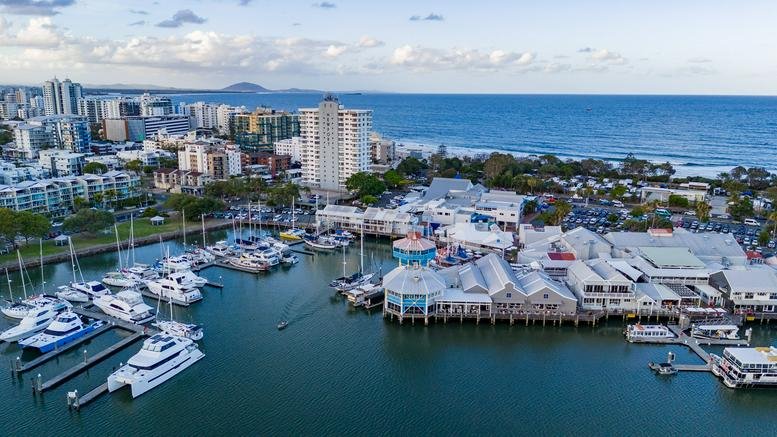Aerial view of The Wharf Mooloolaba complex showing the marina and coastline.
