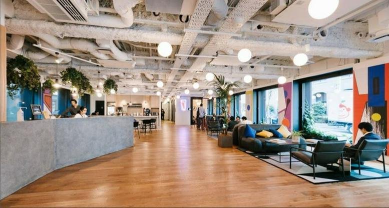 Spacious reception and lounge at Tokyu Yotsuya, 6-6 Kojimachi, Chiyoda-ku, Tokyo, Japan with industrial ceilings.